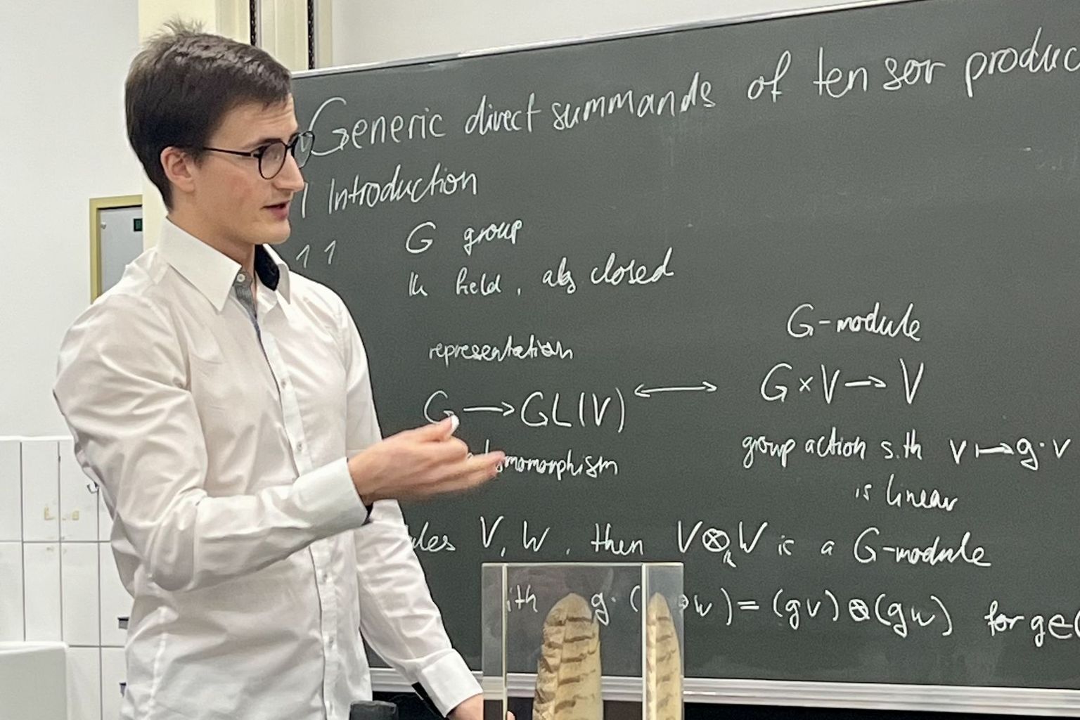 Jonathan Gruber presents his work during the award ceremony. Jonathan Gruber presents his work during the award ceremony.