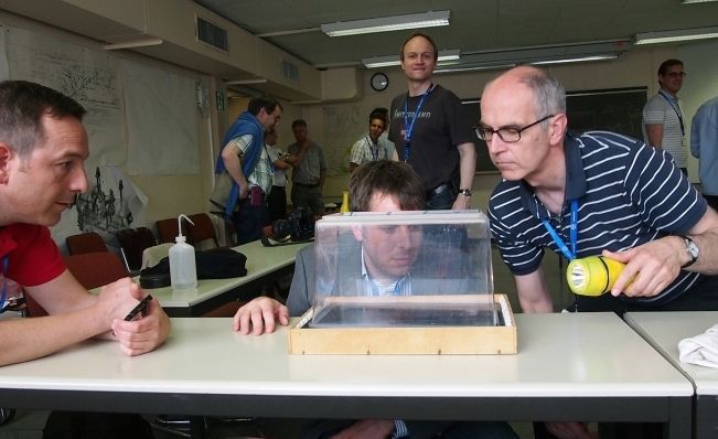 Swiss physics teachers are building a cloud chamber during a training day at CERN in July 2013.