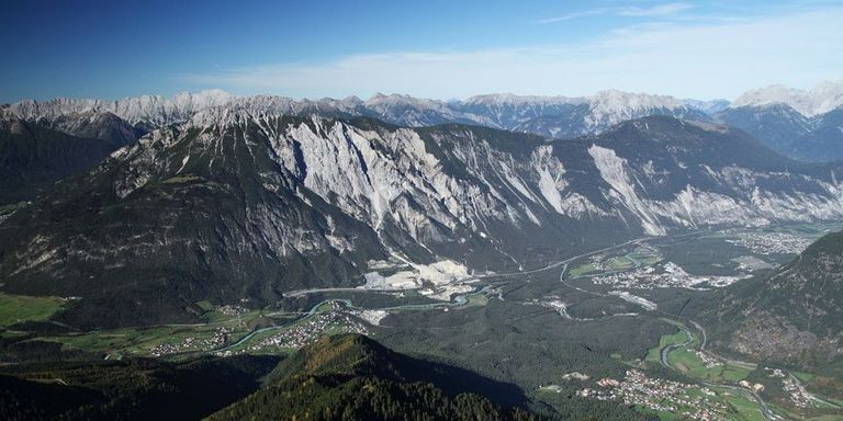 View from Blose. The deposits south of Tschirgant (centre, 2372 m), blocking the outlet of the Ötztal Valley, are most probably the result of more than one large prehistoric rock slide event. The smaller Haiming Rock Avalanche is seen in the right centre of the image.