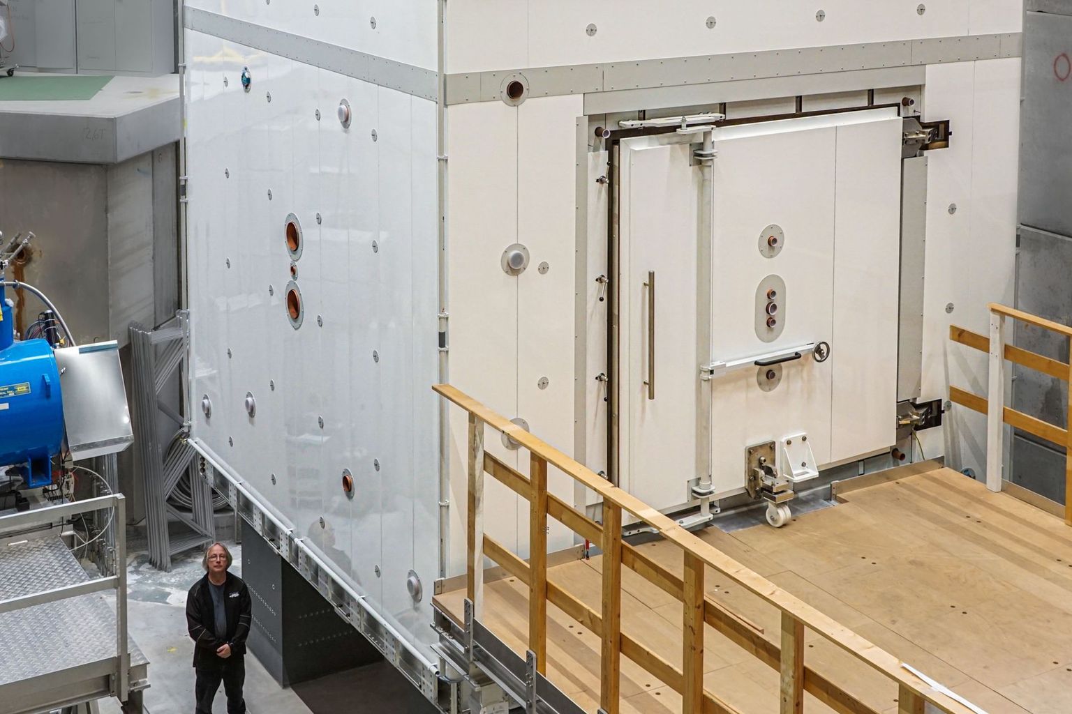 Bernhard Lauss next to the magnetically shielded room of the n2EDM experiment, which will start its search for the electric dipole moment of the neutron next year.