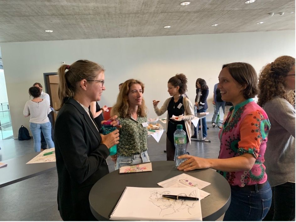 The symposium gave plenty of time for participants to get to know each other and share experiences. Here, L to R: Phoebe Tengdin (EPFL) and Jana Pásztorová (EPFL) discuss with invited speaker and mentor Ana Akrap (Uni Fribourg).