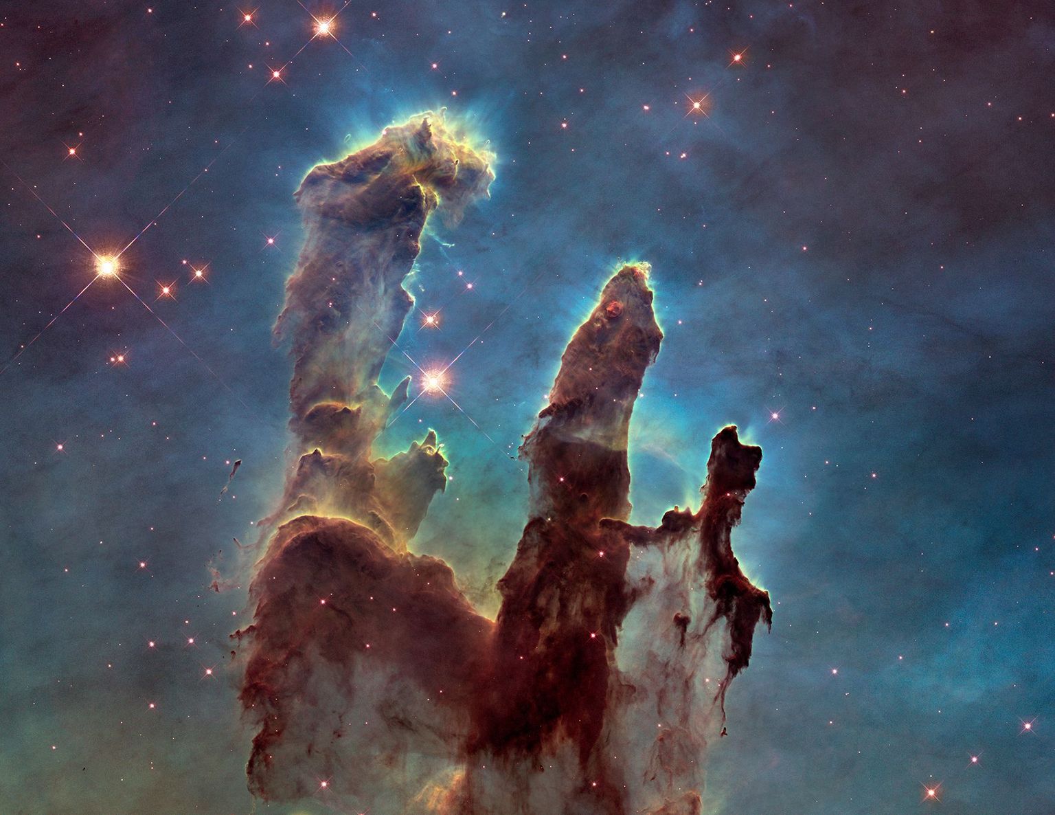Eagle Nebula's "Pillars of Creation". Credits: NASA/ESA/Hubble Heritage Team (STScI/AURA)/J. Hester, P. Scowen (Arizona State U.)