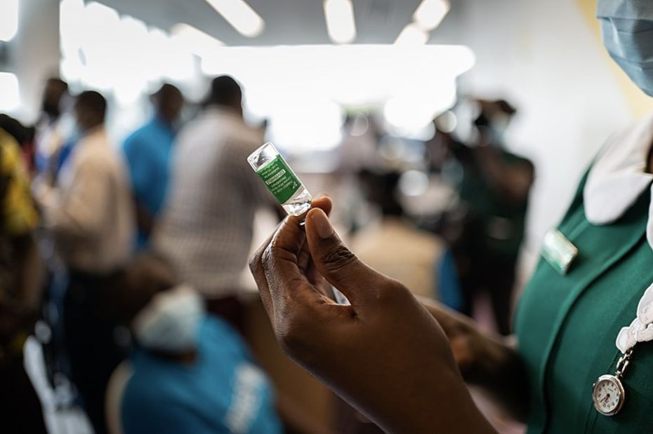 COVAX rollout: COVID-​19 vaccinations begin in Ghana – nurse prepares vaccine on March 2, 2021.