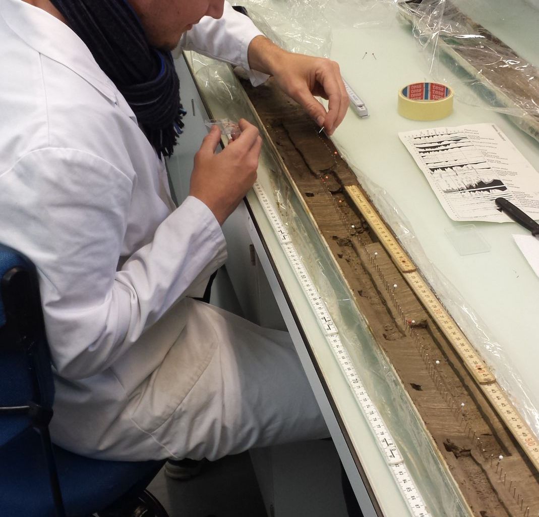 Preparing a sediment core section from Moossee for subsampling.