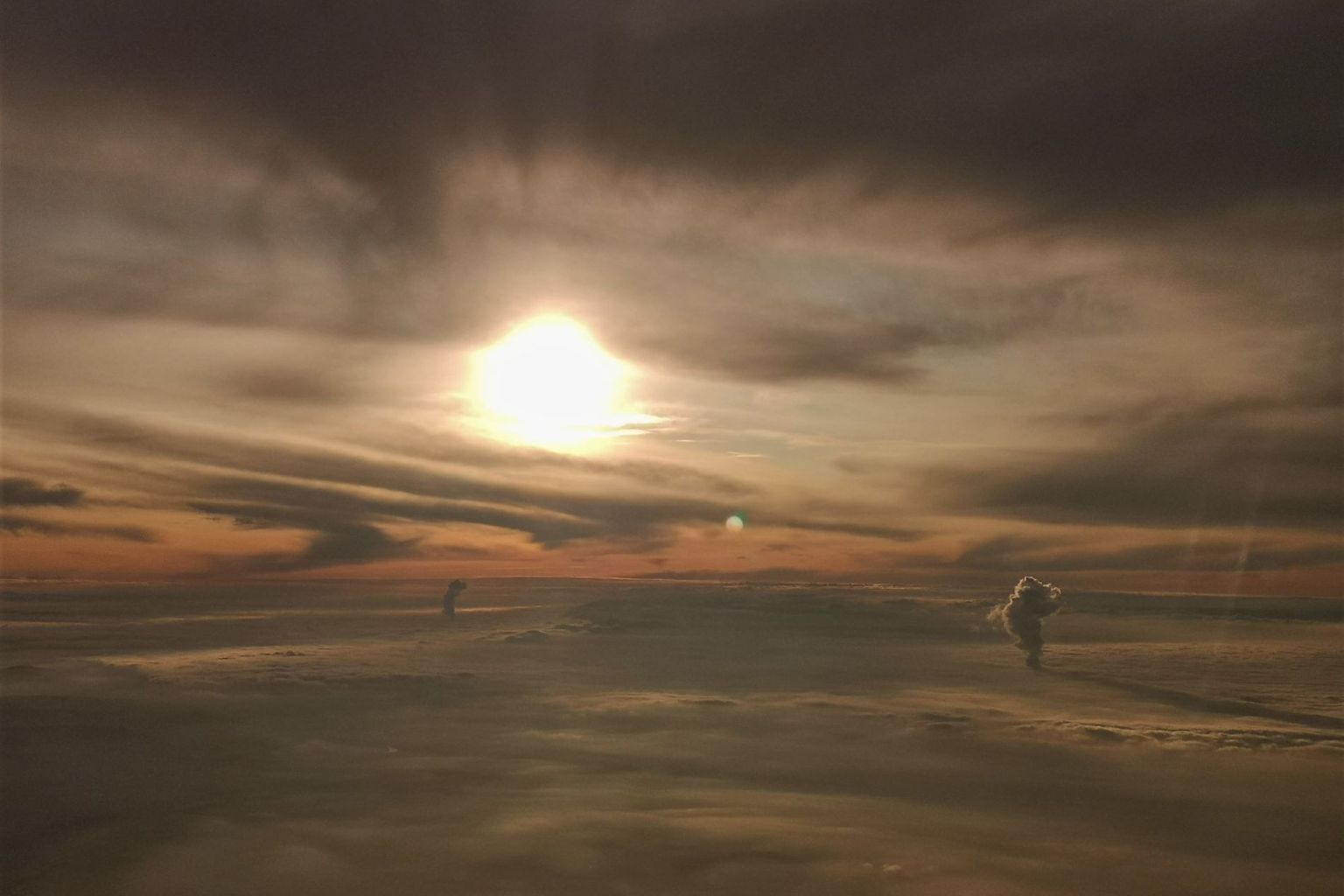 Plumes of the nuclear power plants bursting through the inversion layer